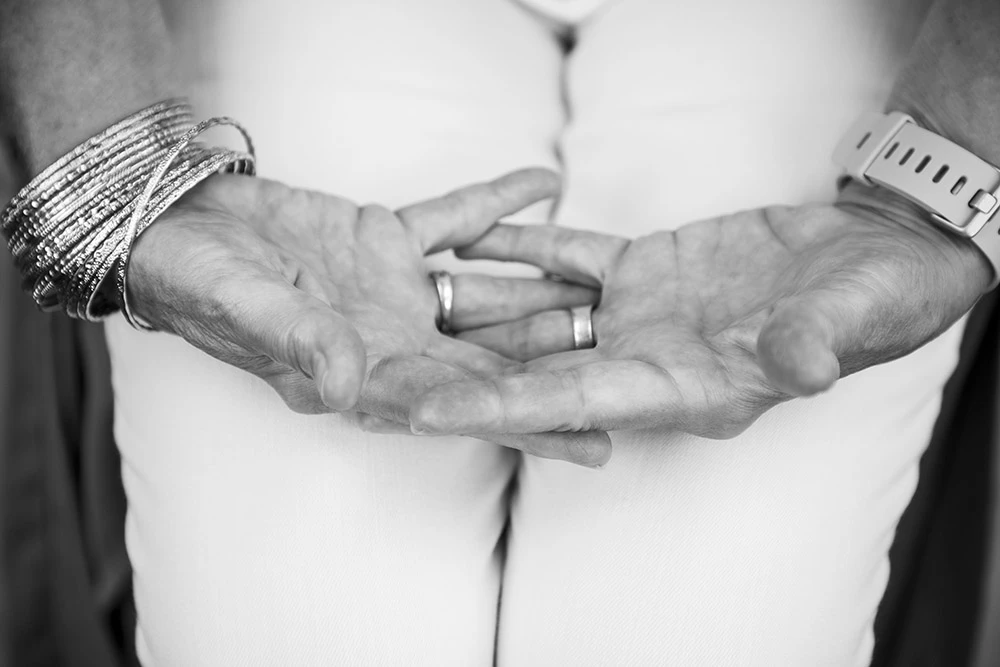open hands with intertwined fingers