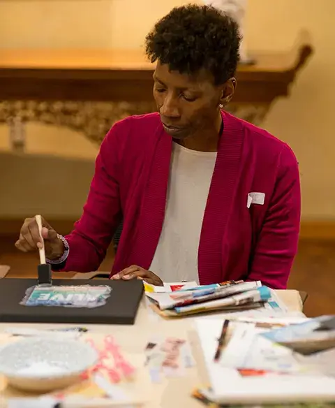 Woman making collage