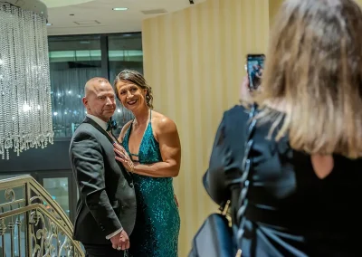 A couple dressed up pose for a photo