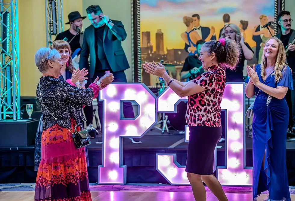 A group of women dance on the dance floor