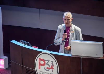 A doctor gives a speech at a podium