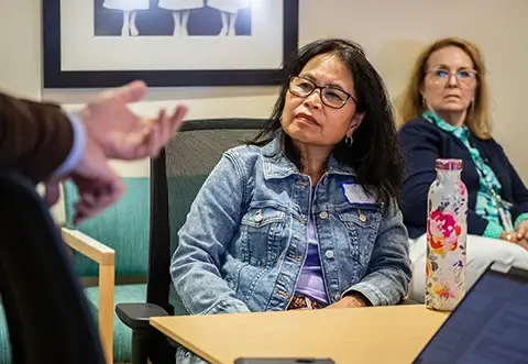 Women listening during presentation
