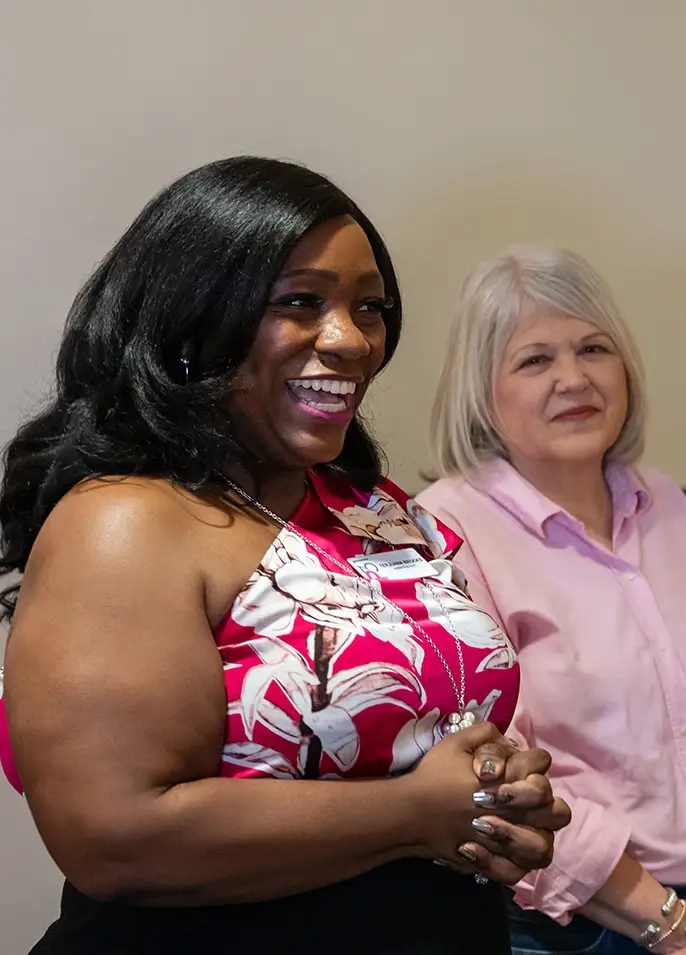 Women smiling at support group