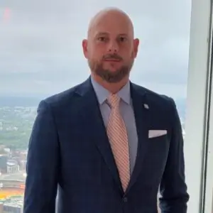 Joshua Wells, Counsel, Voluntary Member