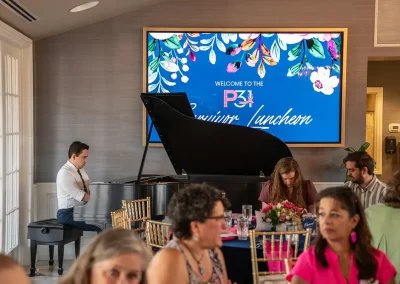 A man plays piano at a luncheon