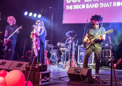 A rock band performs on stage