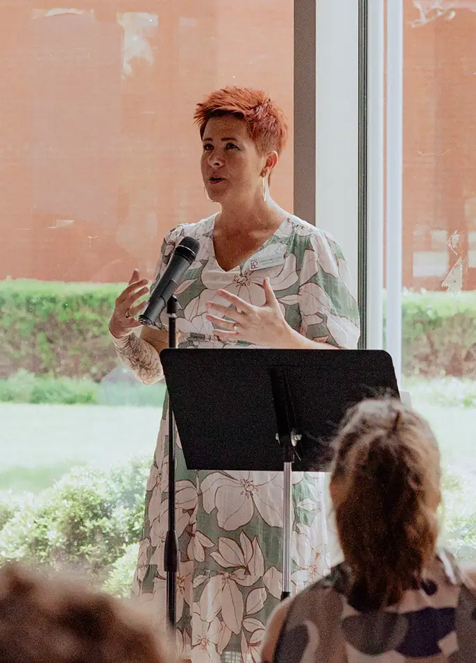Sarah McLean speaking at the Tulsa luncheon
