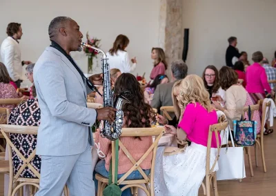 A man plays the saxophone