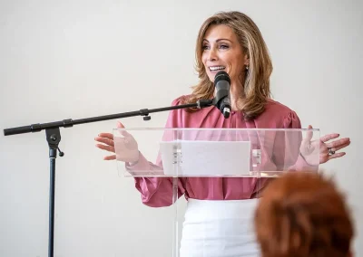 A woman speaks at a luncheon
