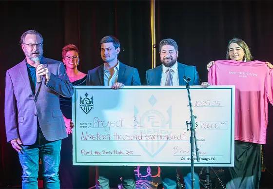 Sponsors presenting check at PTTP gala