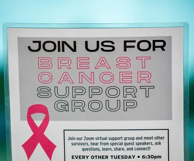 A sign that says, "Join us for breast cancer support group" 