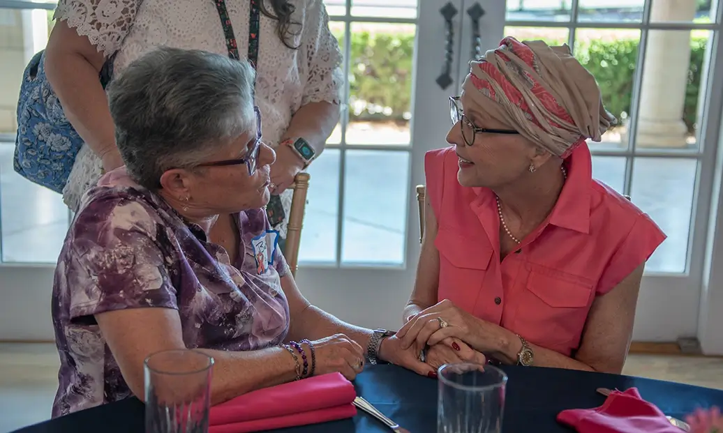Friends talking at Survivor Luncheon