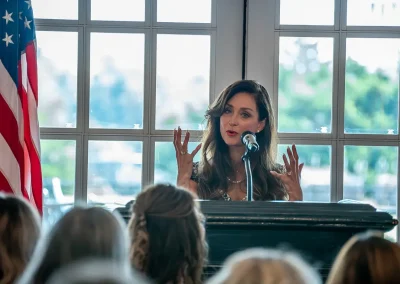 A woman speaks at a brunch